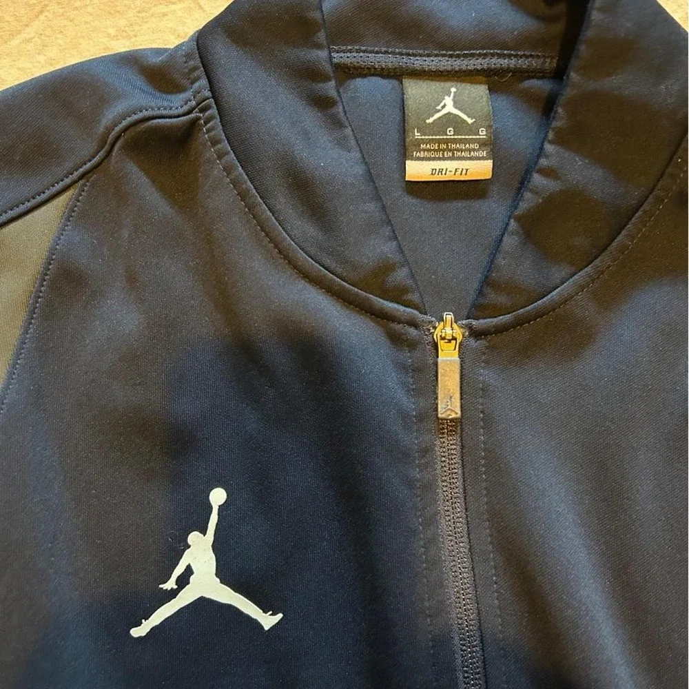 Jordan Dri-Fit navy blue training track jacket with gray panels